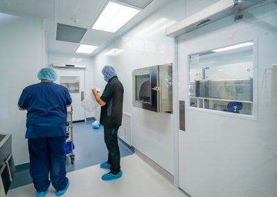two-employees-preparing-to-enter-a-cleanroom