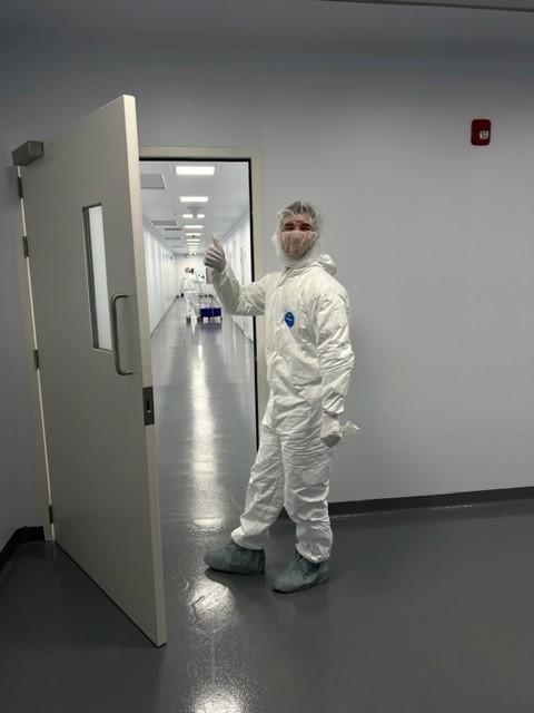 Gowned cleanroom service worker